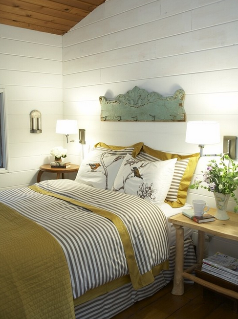 Cottage Bedroom Design--Dwell Studio bedding, painted wood walls and fresh flowers