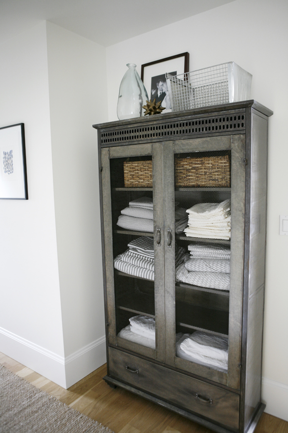 Gorgeous bathroom linen cabinet from a modern farmhouse by h2 Design + Build 