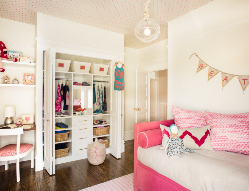 Charming girl's room with pink daybed, organized closet, polka-dotted ceiling. 