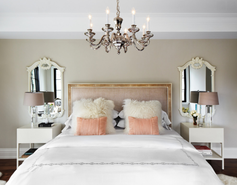 Glamorous bedroom with soft blush hues.