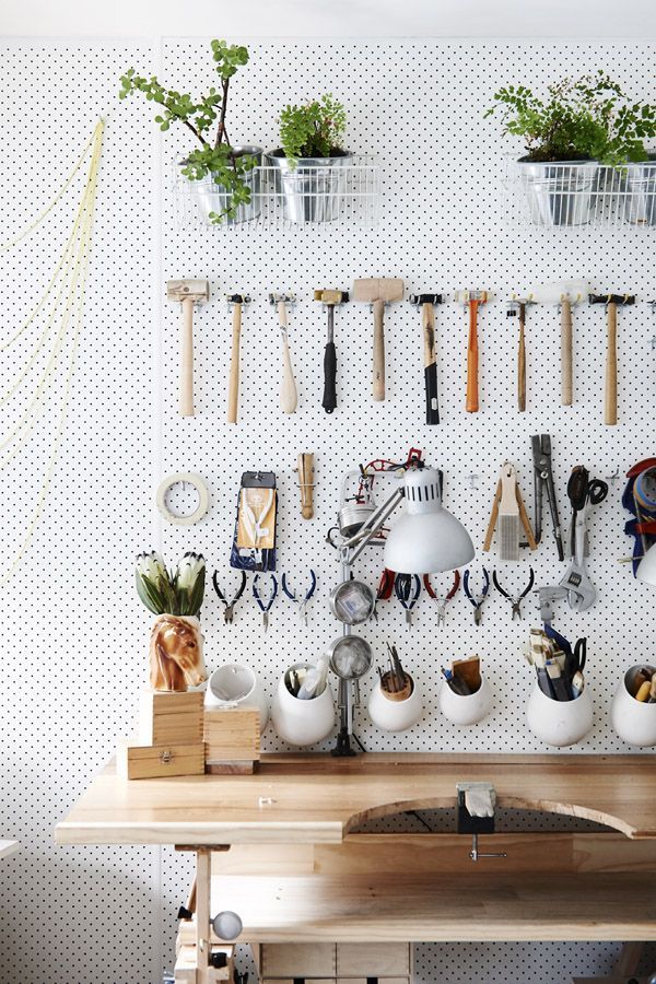 Love this pegboard used to beautifully organize tools in a design studio.