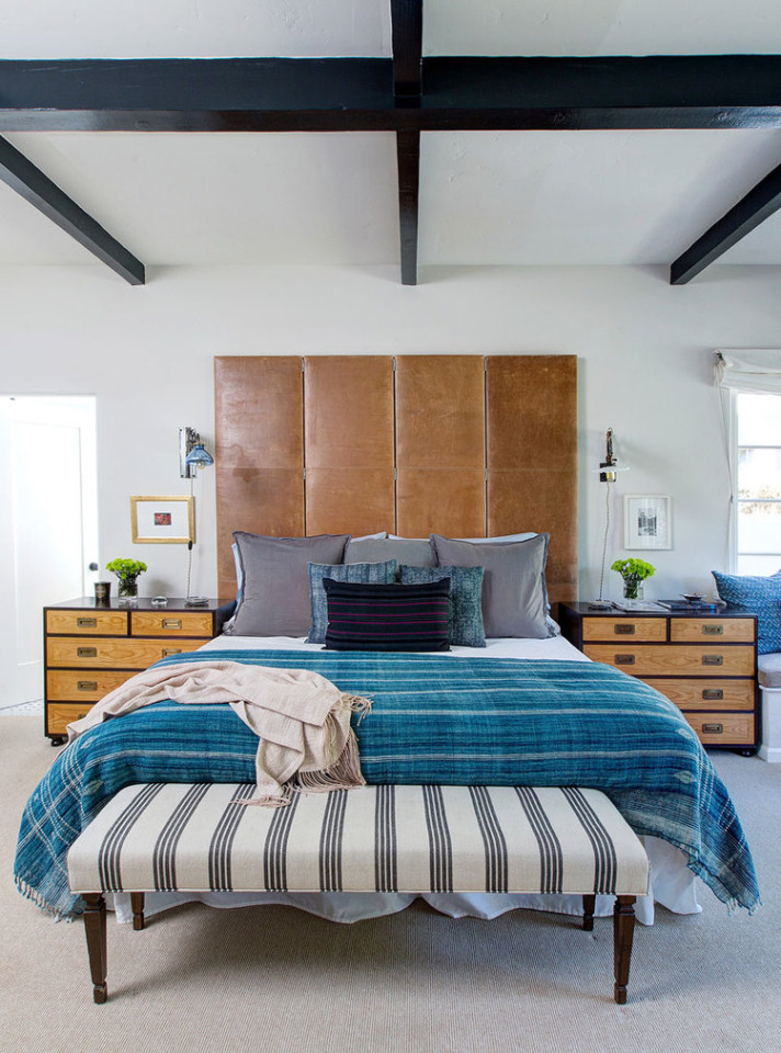 Obsessed with this leather headboard, exposed ceiling beams and blue accents 