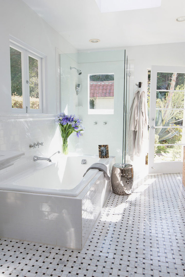 Gorgeous bathroom with basketweave tile and tons of light. 