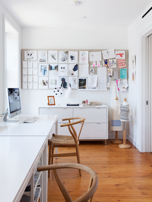 Modern, light-filled workspace with large inspiration board. 