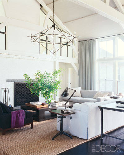 Meg Ryan's home on Martha's Vineyard. Love those giant white ceiling beams, natural weave rug, creamy color palette, and industrial accents.