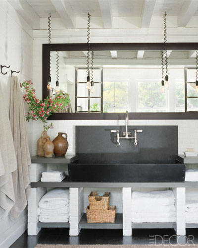 Worship at this antique soapstone basin! (Plus hanging pendant lights and bluestone counters.) 