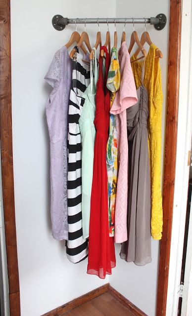 Great small space solution---the corner hanging bar closet! 