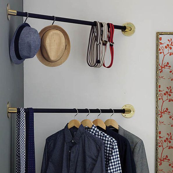 Great small space solution---the corner hanging bar closet! 