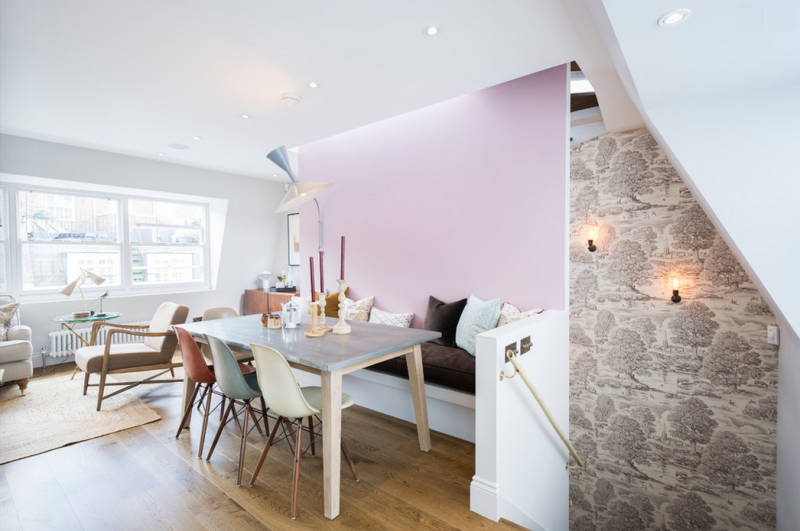 Lovely banquette with a pink wall from this Notting Hill mews house.