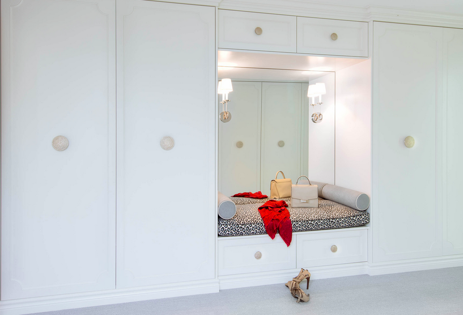 From the work of Meghan Carter Design Inc. --built-in wardrobe with bench and cheetah-print cushion.
