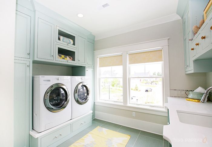 the ideal laundry room definitely has a pedestal washer/dryer. More storage space and less bending over? Sign me up!