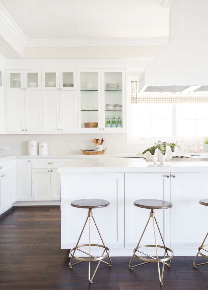 Gorgeous white kitchen with herringbone backsplash by Studio McGee