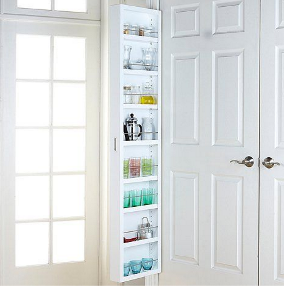 This is a genius idea for small spaces--take advantage of the potential storage space behind the door! 