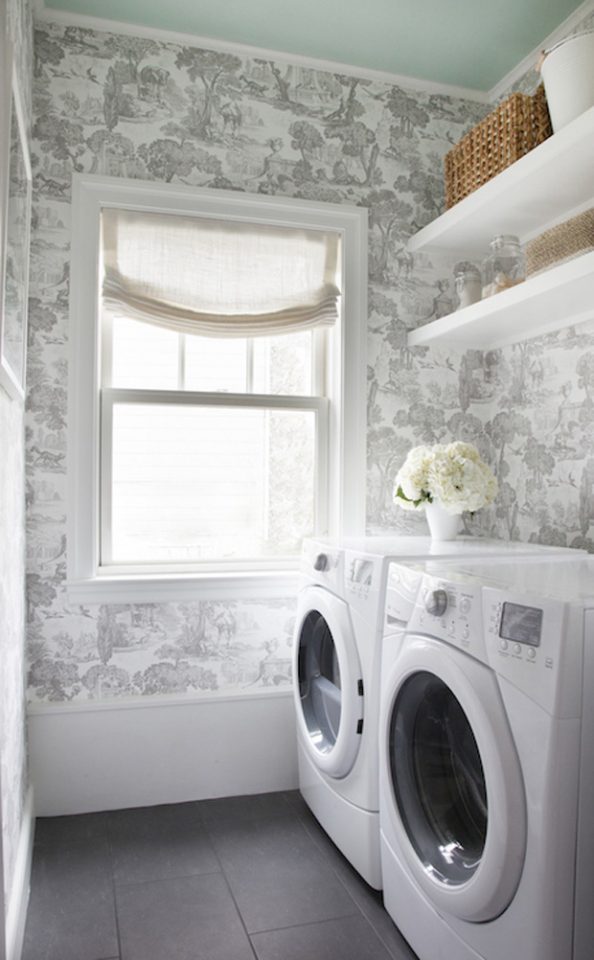Seriously dreamy laundry room design with beautiful wallpaper and a painted ceiling to boot. 