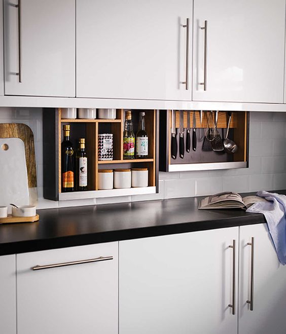 Ingenious kitchen design feature--the hidden pull-down cabinet plus.